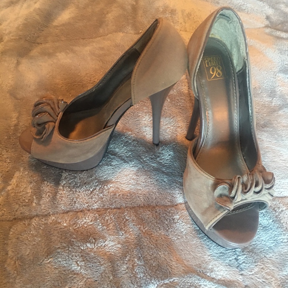 Taupe 5 inch heels, suede ruffles in the front.